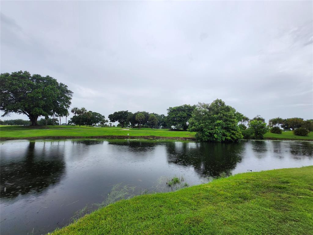 2156 Southwest 82nd Avenue, Unit 2156 Davie, FL 33324 - Photo 5 of 24 an aerial view of a house with a garden and lake view