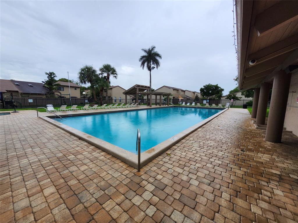 2156 Southwest 82nd Avenue, Unit 2156 Davie, FL 33324 - Photo 7 of 24 a view of a terrace with chairs