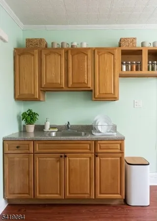 a stove top oven sitting inside of a kitchen