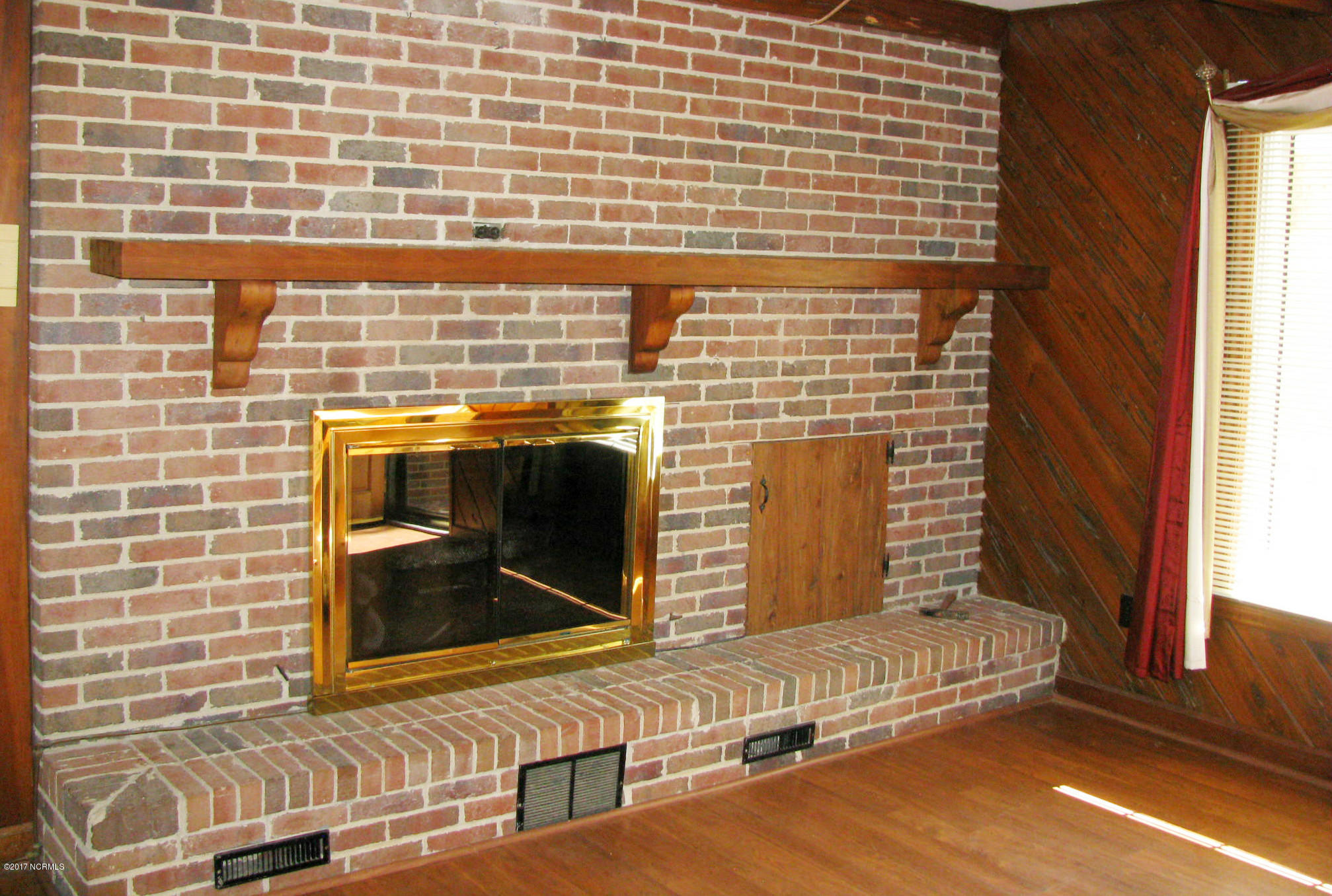 3947 Eds Grocery Road Williamston, NC 27892 - Photo 21 of 30 Den with fireplace. Cypress plank walls.