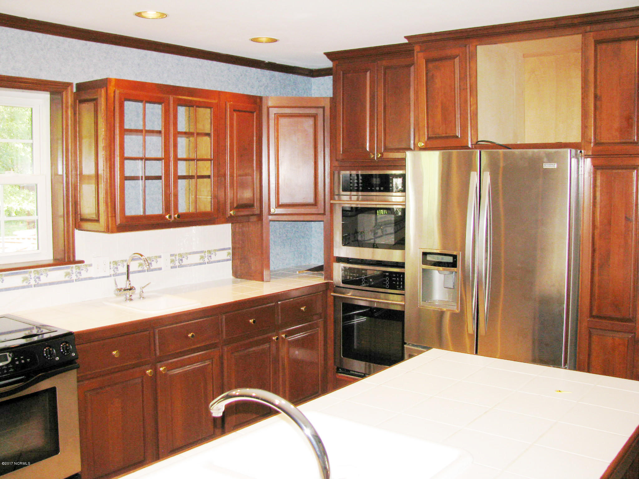 3947 Eds Grocery Road Williamston, NC 27892 - Photo 3 of 30 Cherry finish cabinets, prep sink