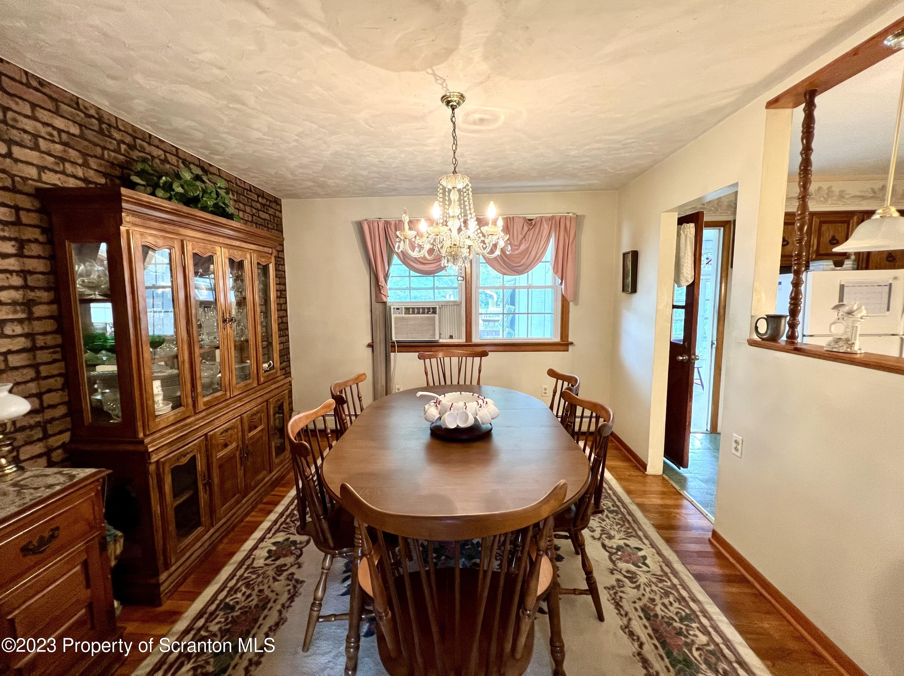 218 Jackson Street Olyphant, PA 18447 - Photo 12 of 46 a view of a dining room with furniture window and wooden floor