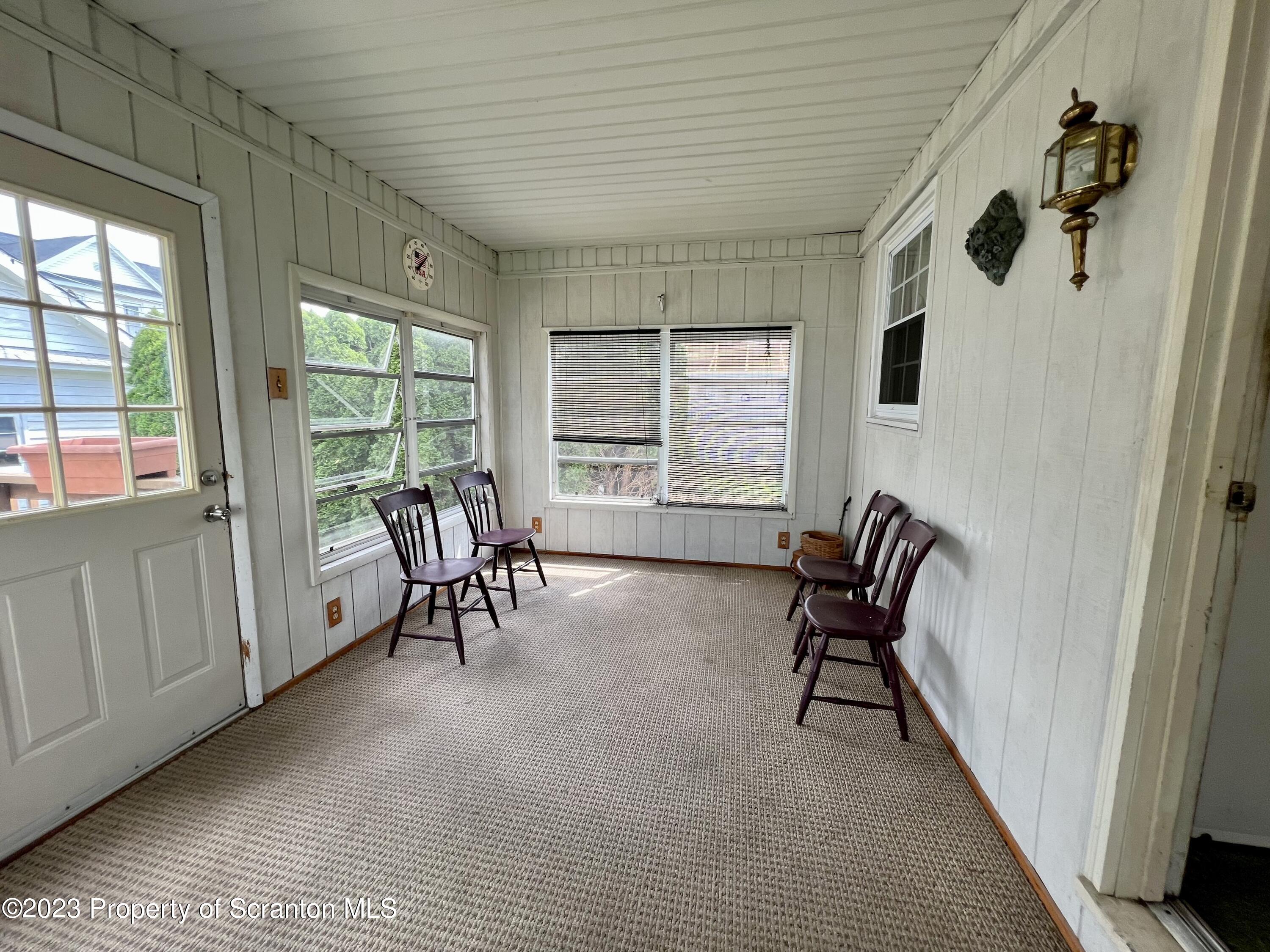 218 Jackson Street Olyphant, PA 18447 - Photo 13 of 46 a view of a livingroom with furniture and a window