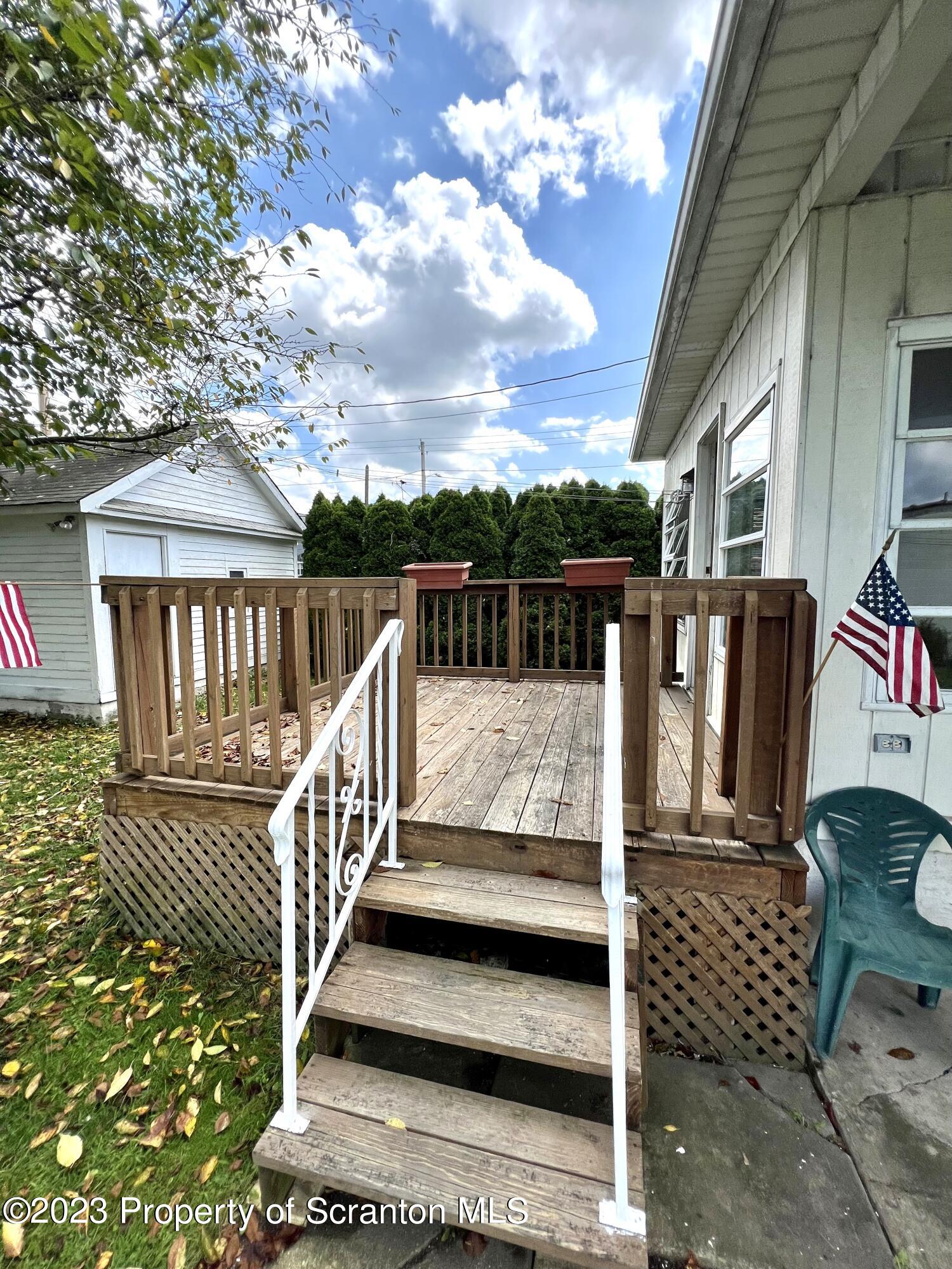 218 Jackson Street Olyphant, PA 18447 - Photo 14 of 46 a view of balcony with wooden floor and fence