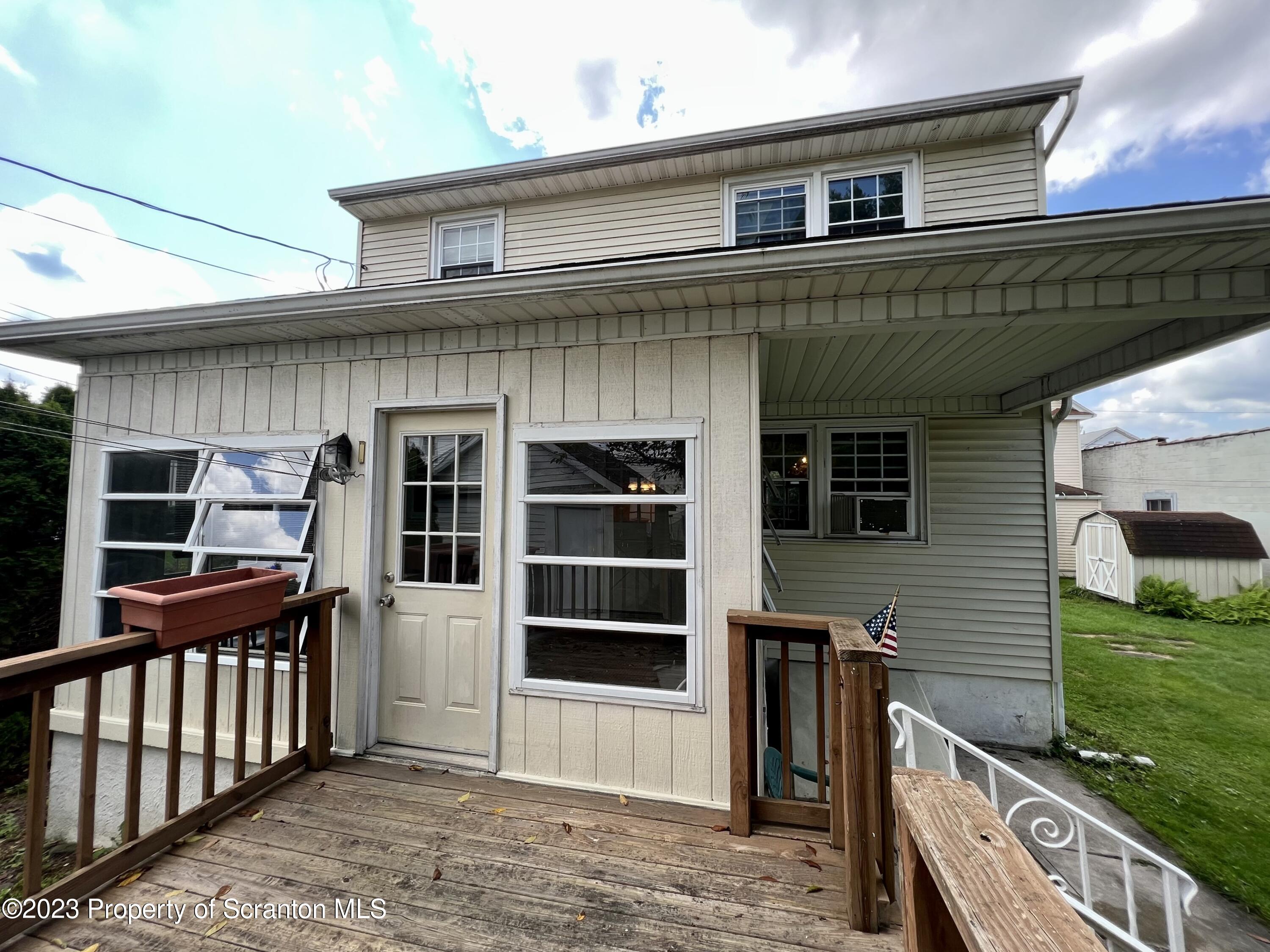 218 Jackson Street Olyphant, PA 18447 - Photo 15 of 46 a view of a house with a balcony