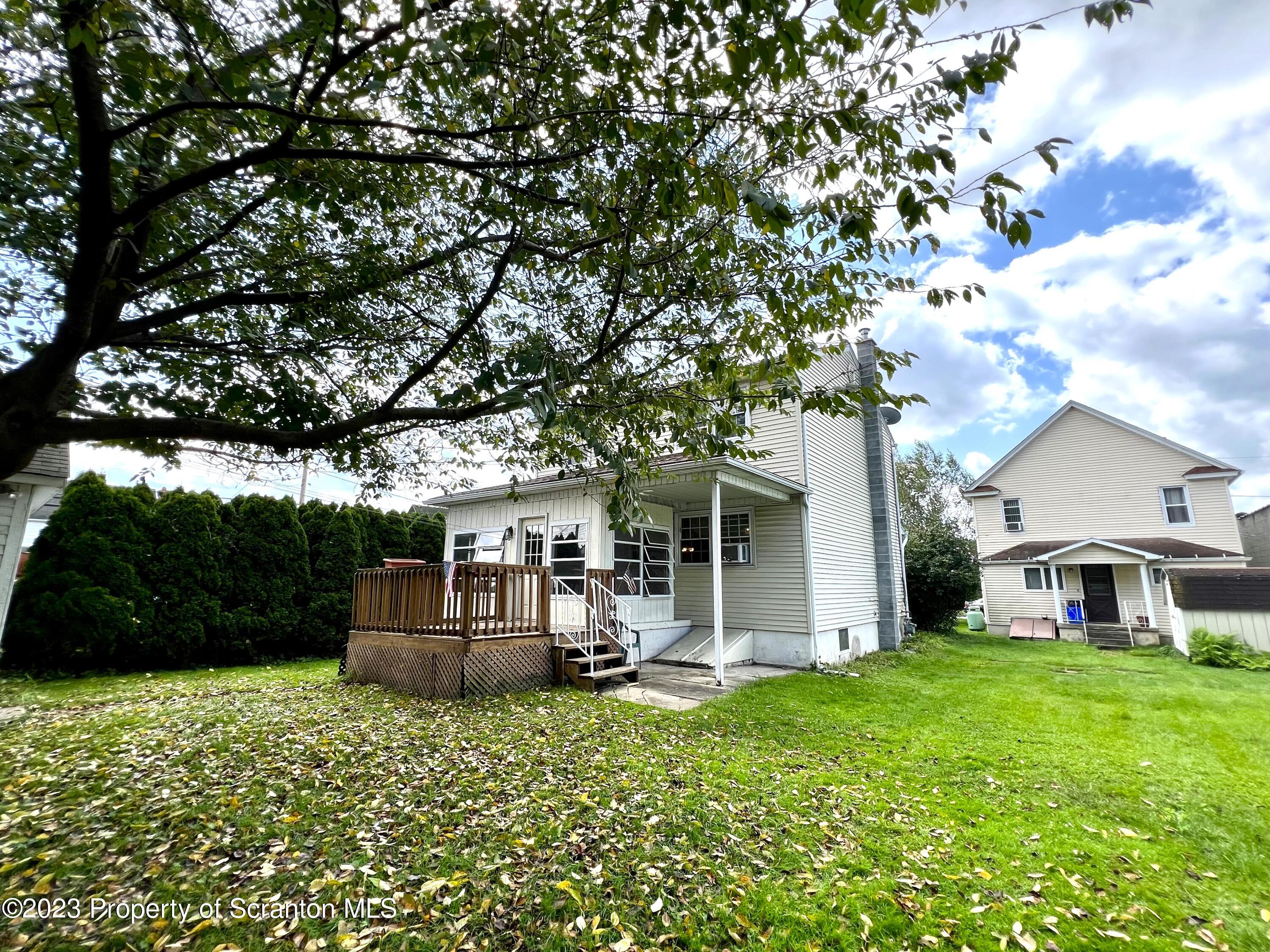 218 Jackson Street Olyphant, PA 18447 - Photo 16 of 46 a front view of a house with garden