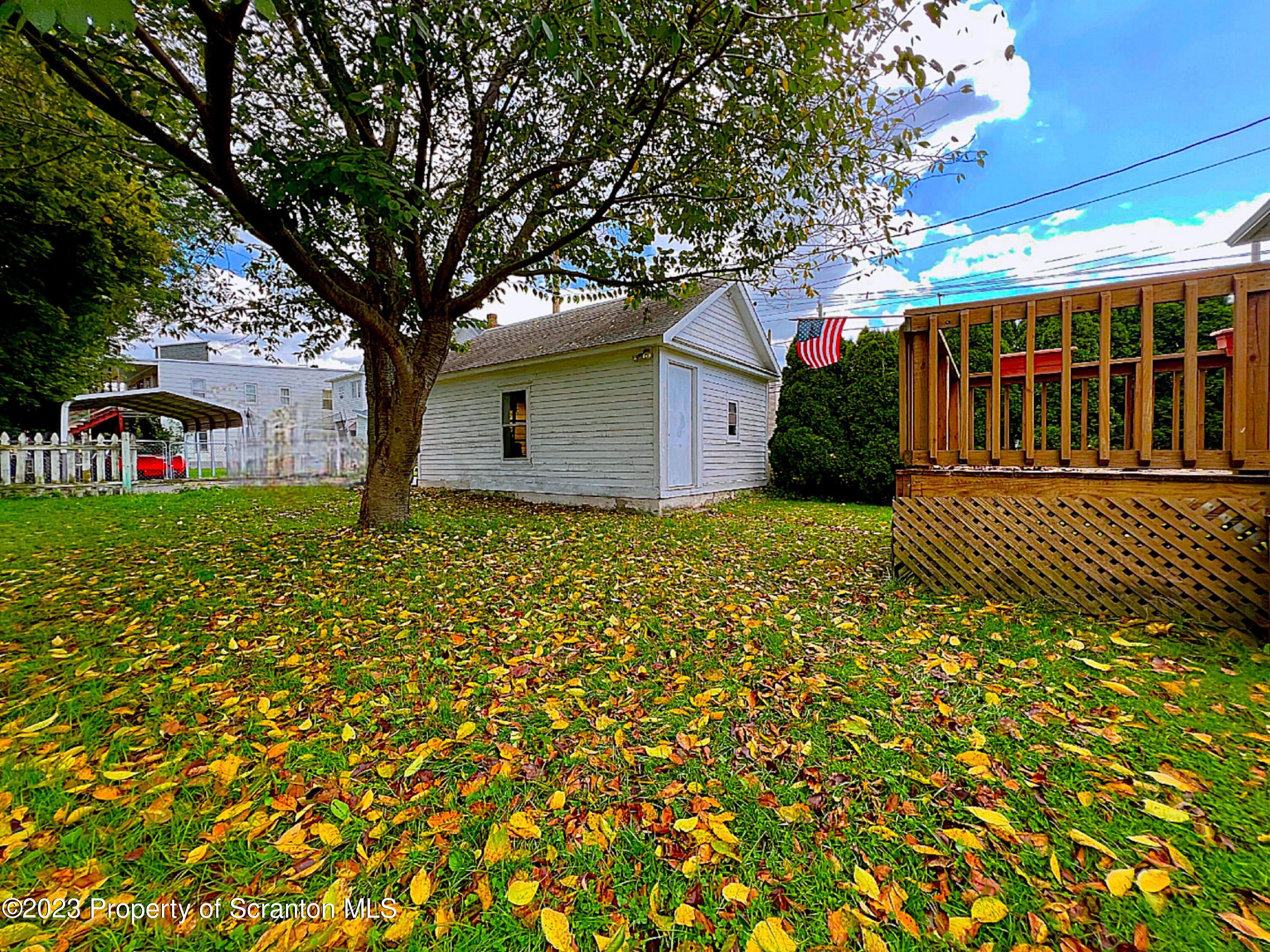 218 Jackson Street Olyphant, PA 18447 - Photo 19 of 46 a view of a house with a tree in front of it