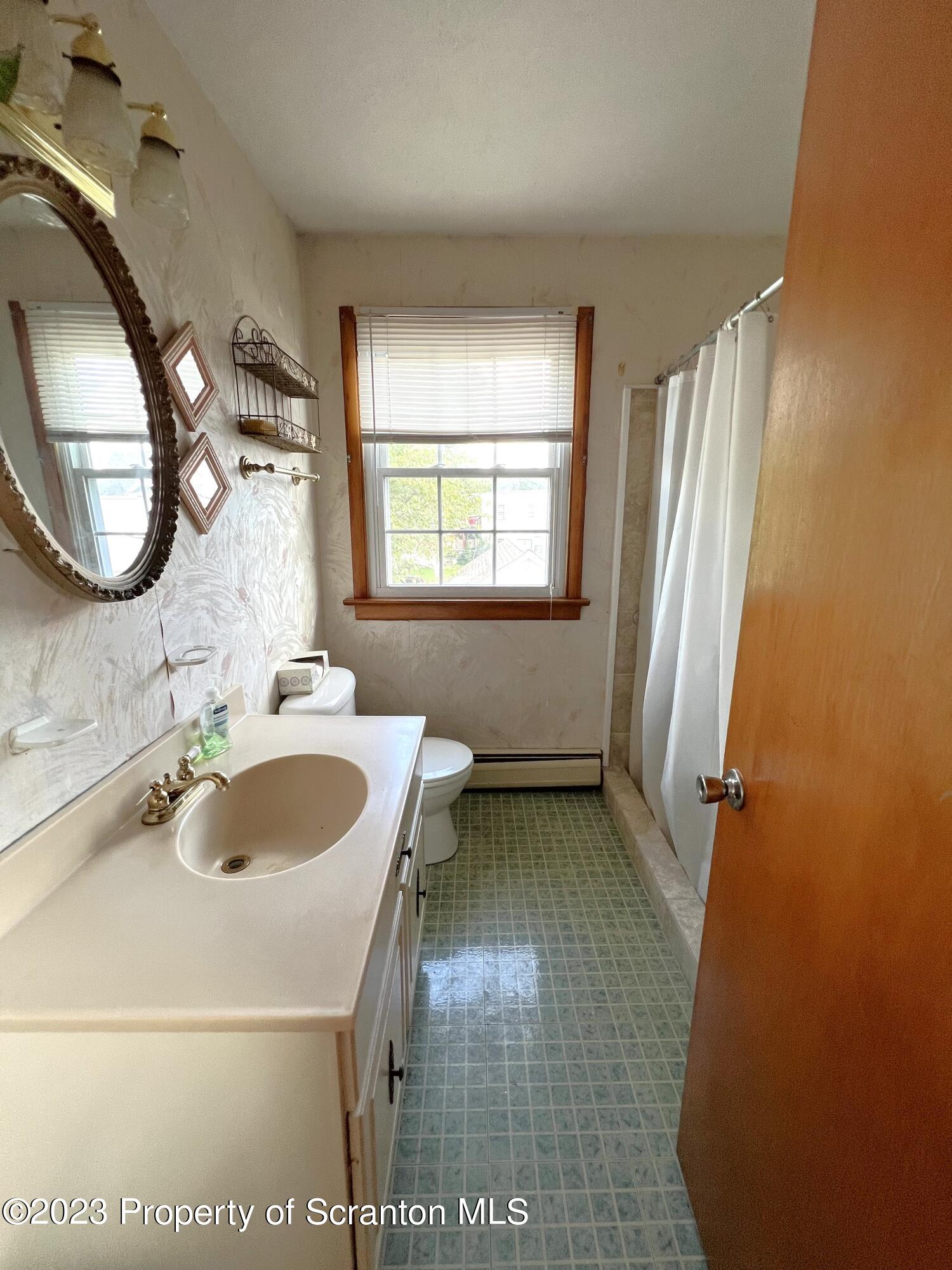 218 Jackson Street Olyphant, PA 18447 - Photo 22 of 46 a bathroom with a sink and a mirror