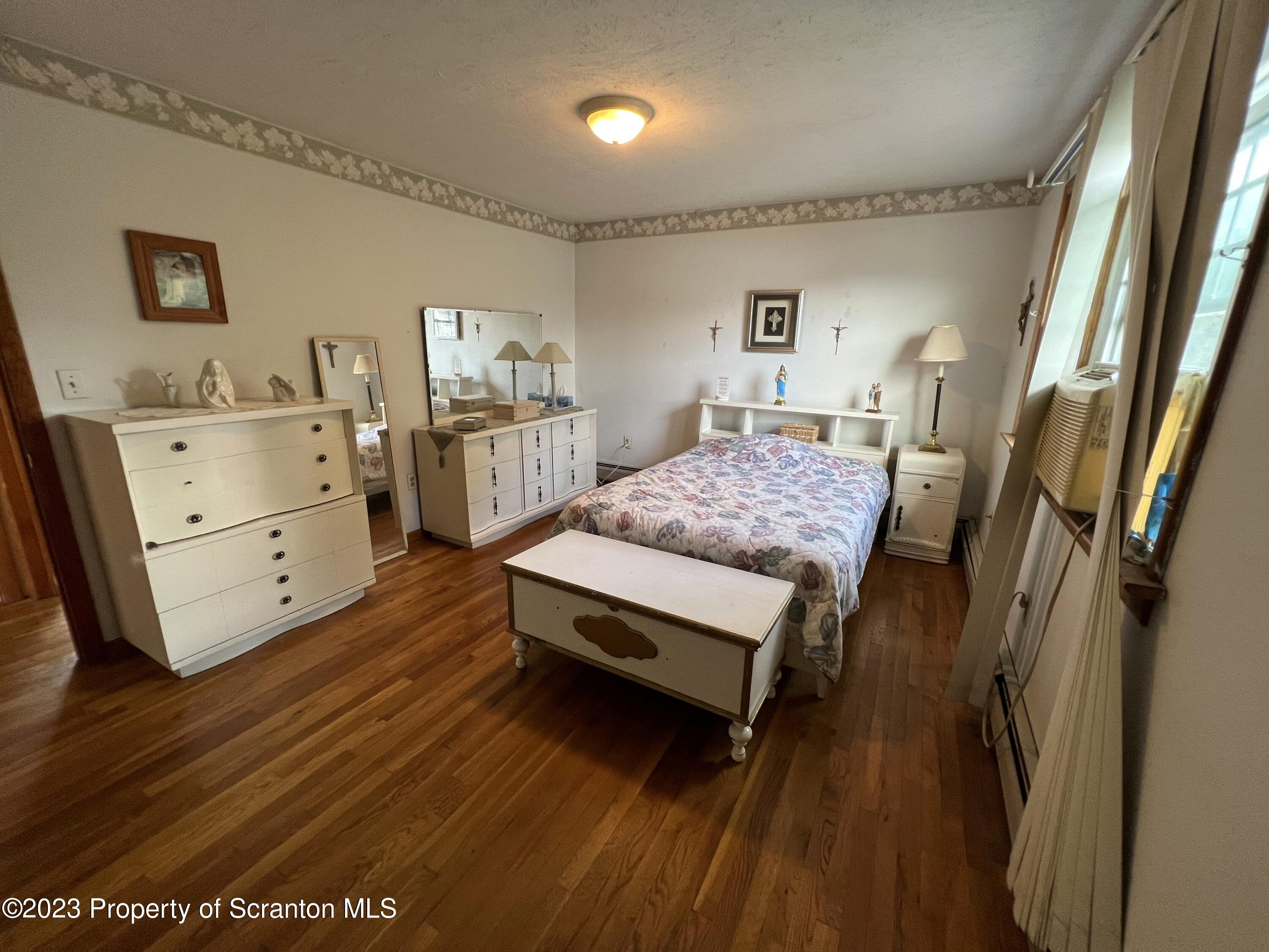 218 Jackson Street Olyphant, PA 18447 - Photo 25 of 46 a bedroom with a bed and a dresser in it