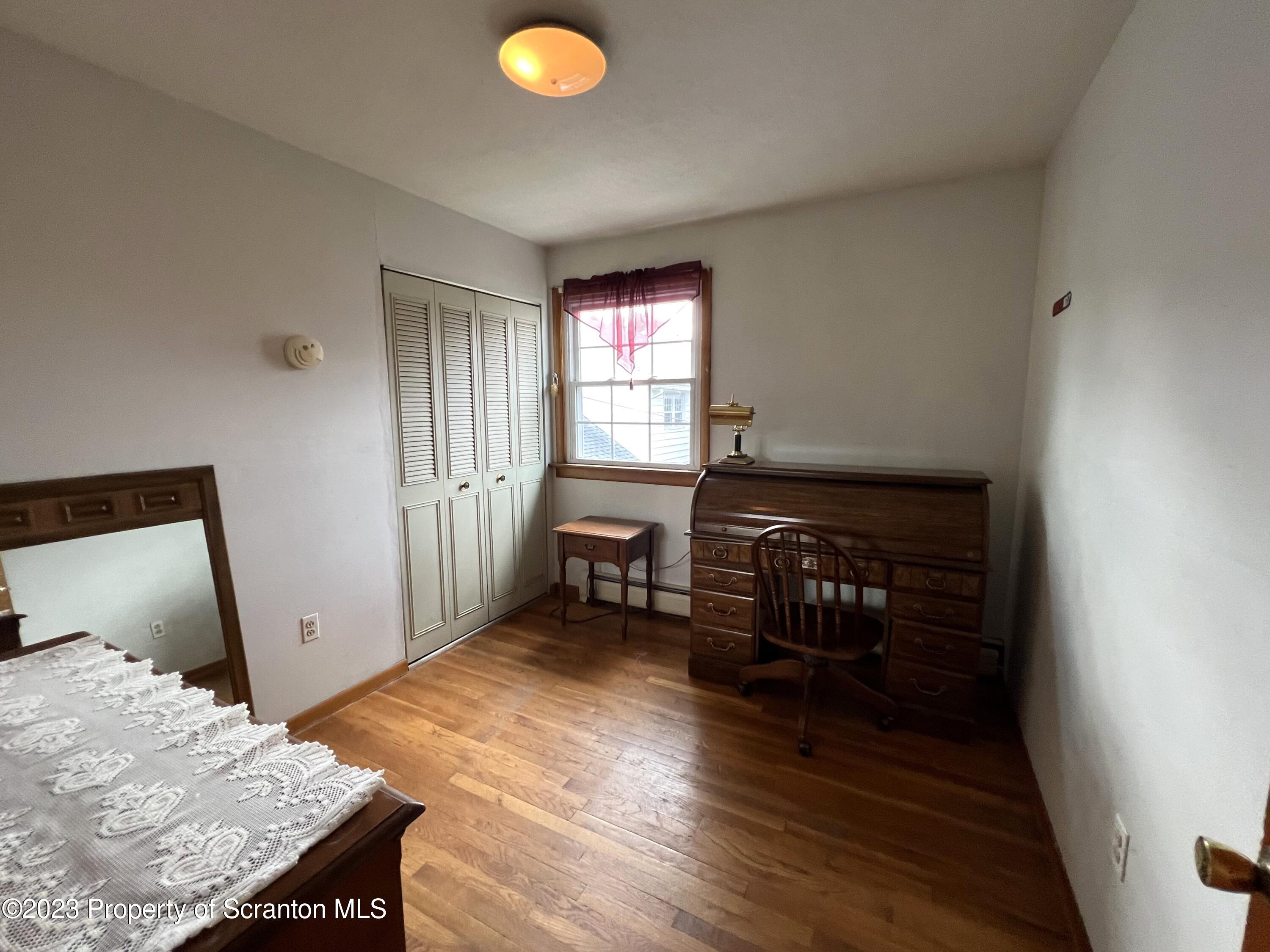 218 Jackson Street Olyphant, PA 18447 - Photo 29 of 46 a bed room with a bed and furniture