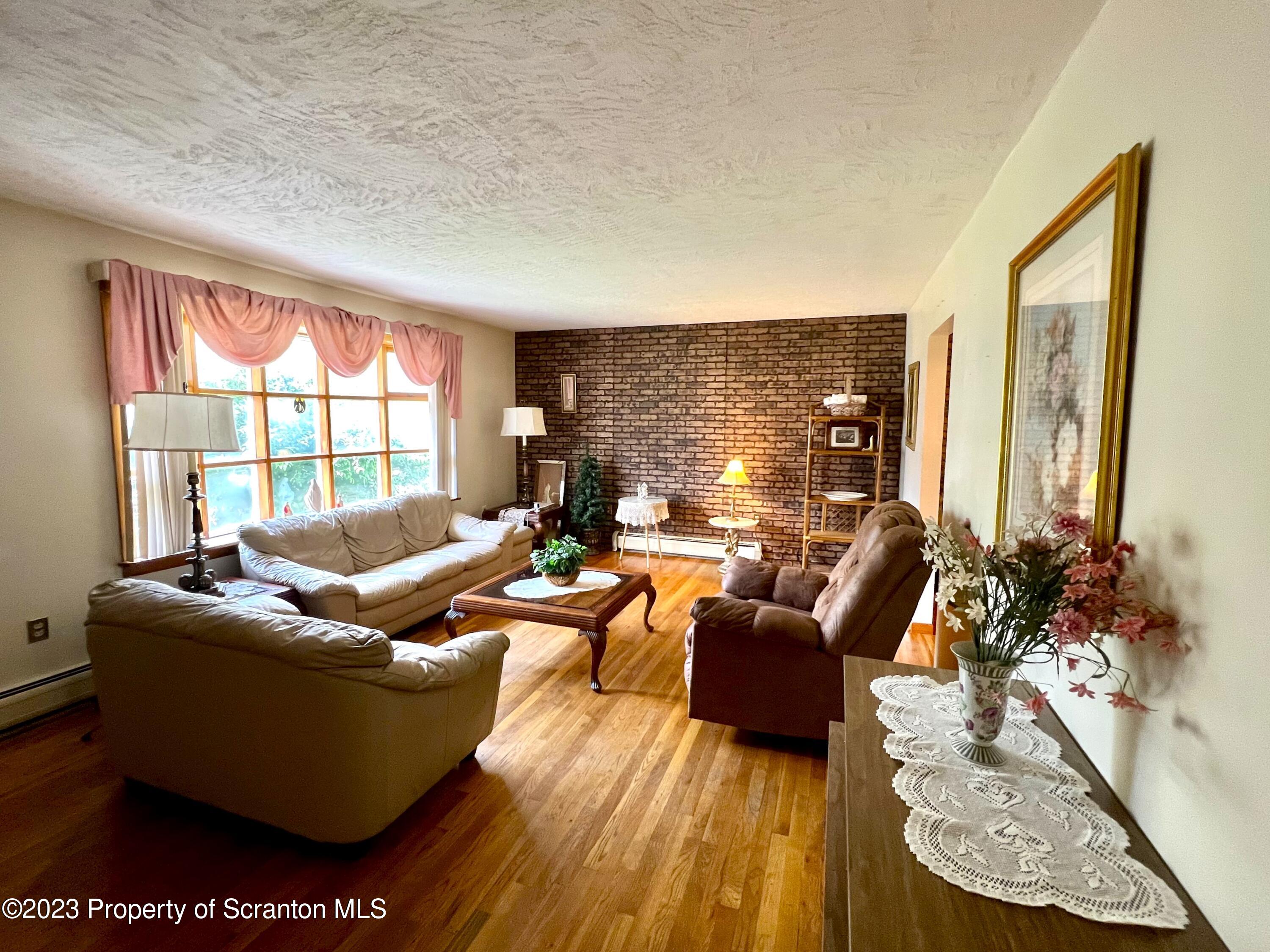 218 Jackson Street Olyphant, PA 18447 - Photo 3 of 46 a living room with furniture and a large window