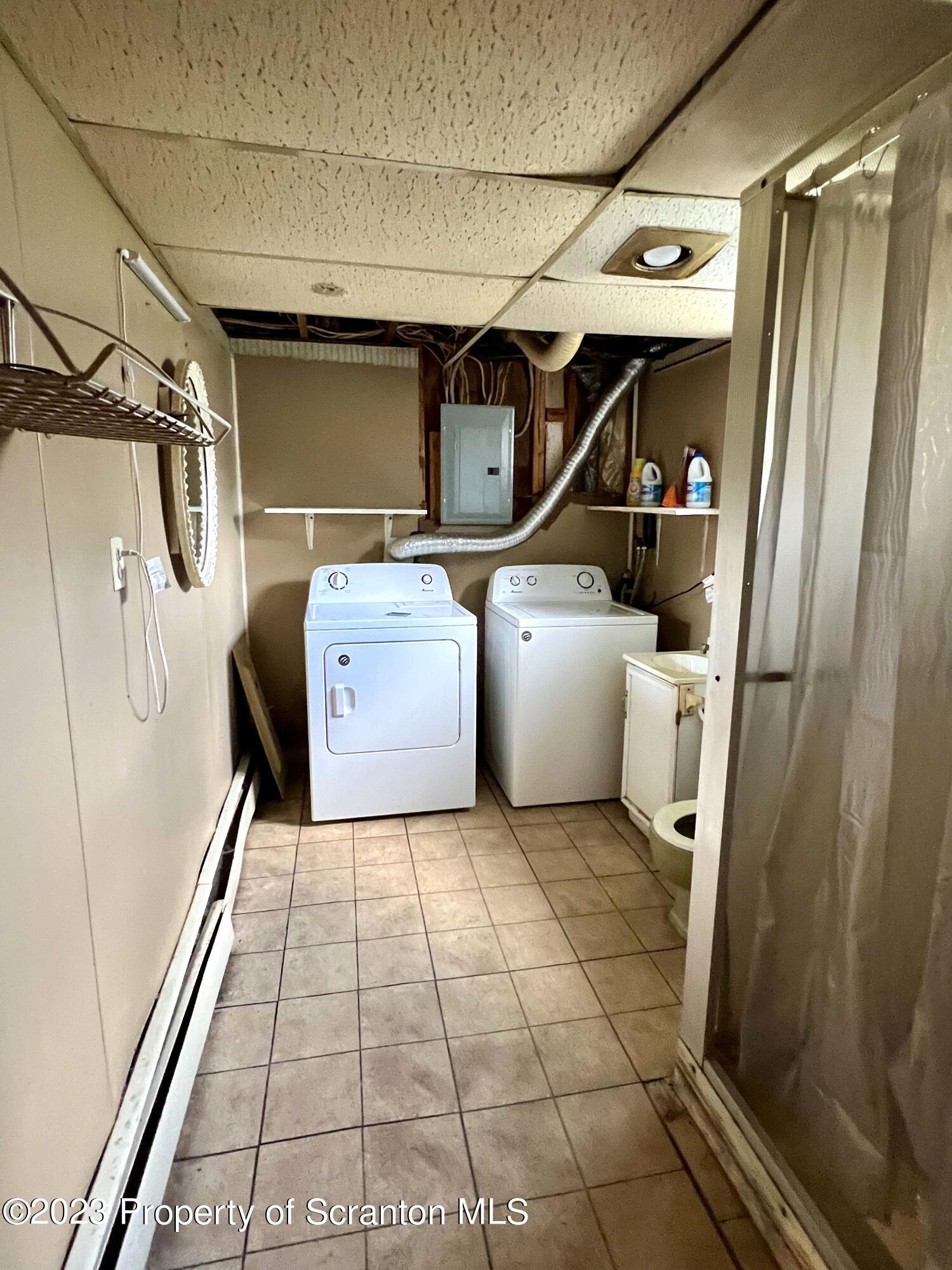 218 Jackson Street Olyphant, PA 18447 - Photo 36 of 46 a utility room with dryer and washer