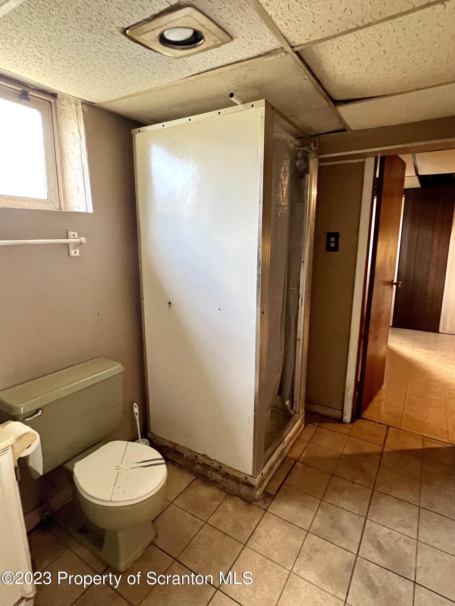 218 Jackson Street Olyphant, PA 18447 - Photo 37 of 46 a bathroom with a toilet and a shower