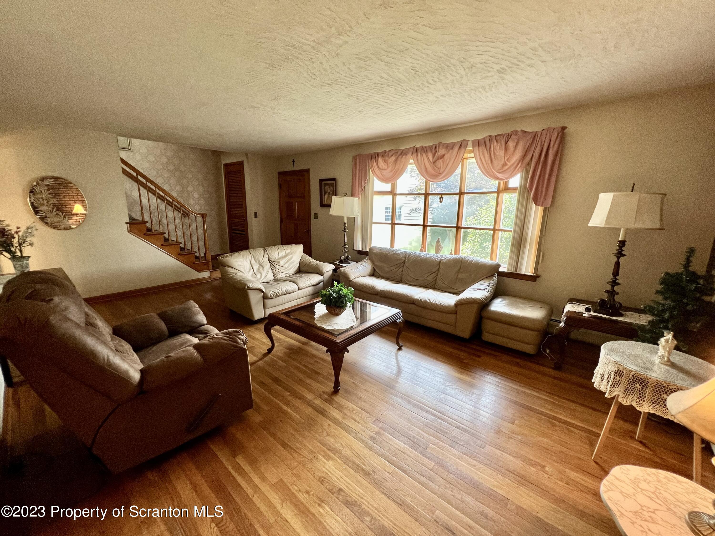 218 Jackson Street Olyphant, PA 18447 - Photo 4 of 46 a living room with furniture and a window