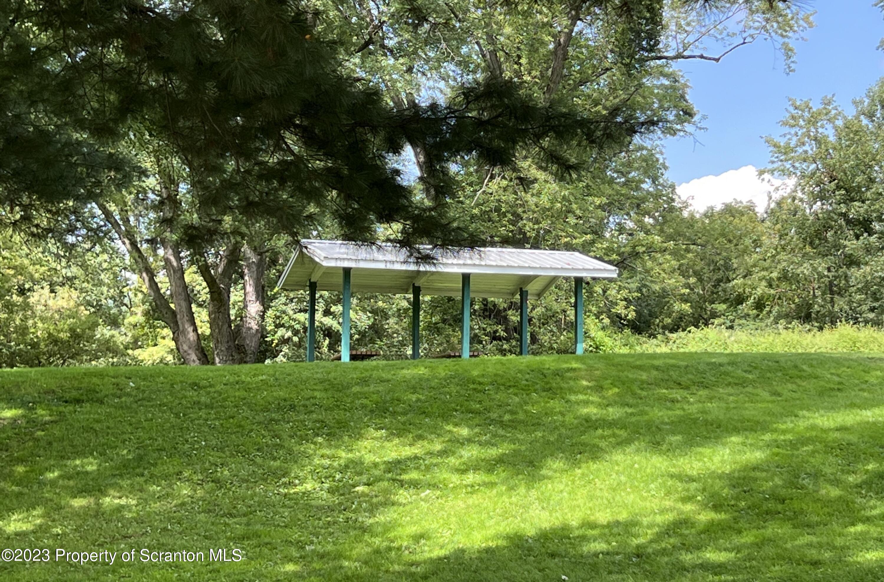 218 Jackson Street Olyphant, PA 18447 - Photo 42 of 46 a view of a table and chairs in the garden