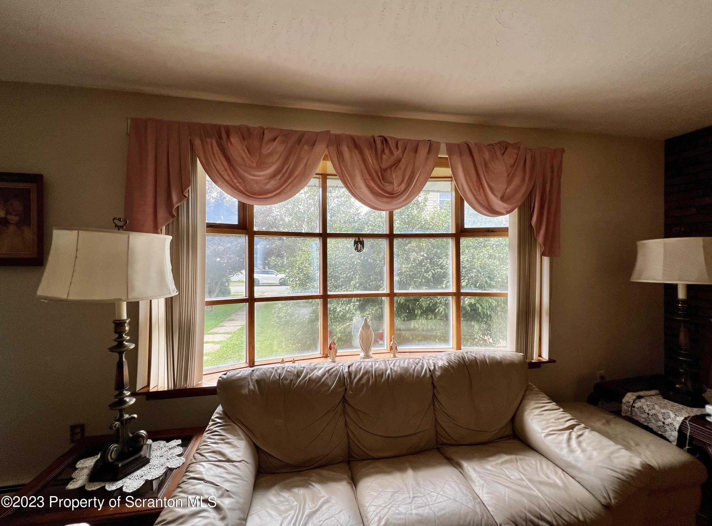 218 Jackson Street Olyphant, PA 18447 - Photo 5 of 46 a living room with furniture and a window