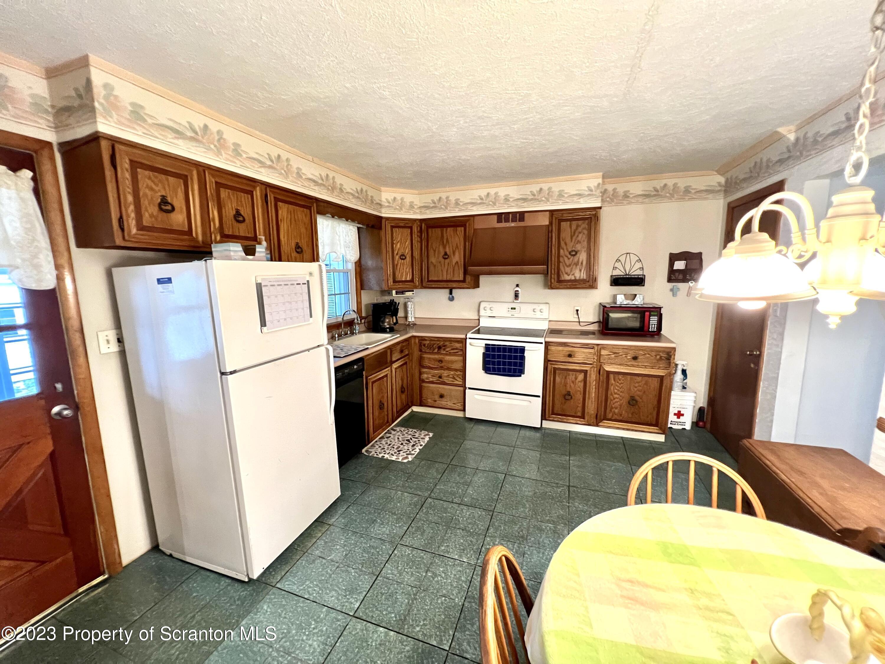 218 Jackson Street Olyphant, PA 18447 - Photo 9 of 46 a kitchen with a sink appliances and cabinets