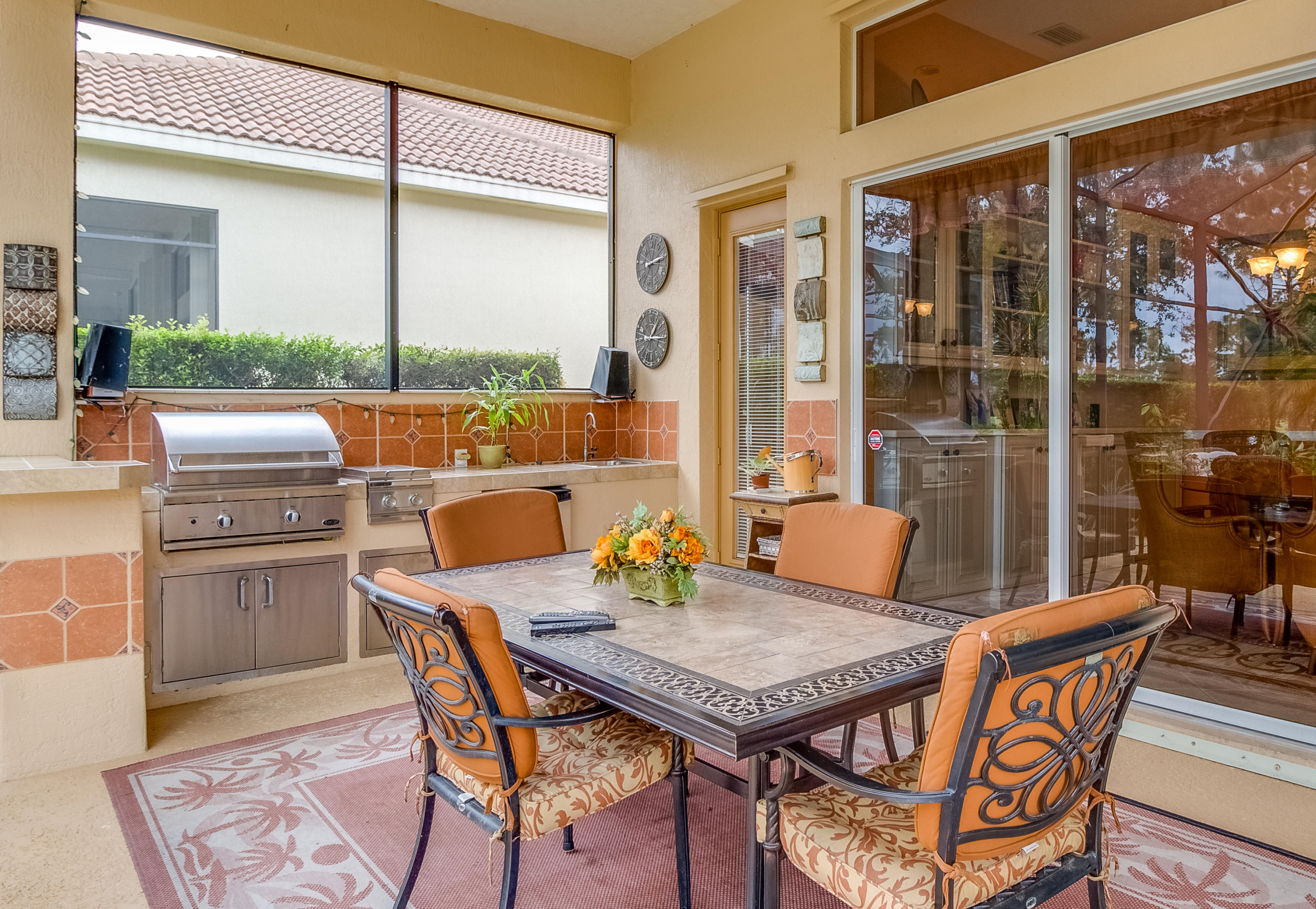8617 Tompson Point Road Port St. Lucie, FL 34986 - Photo 32 of 38 a outdoor dining space with furniture and wooden floor