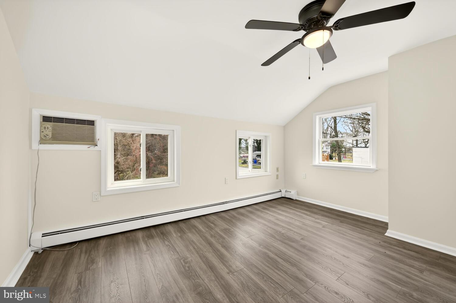 6746 Quaker Neck Road Chestertown, MD 21620 - Photo 47 of 50 a view of an empty room with wooden floor and a window