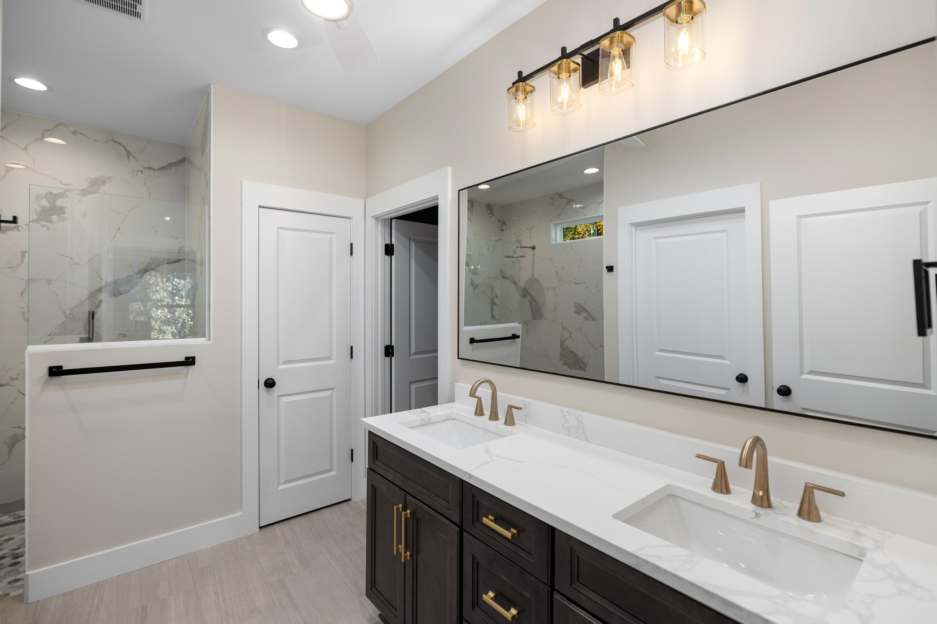 119 Spruce Street Freeport, FL 32439 - Photo 10 of 28 a bathroom with a sink double vanity and a mirror