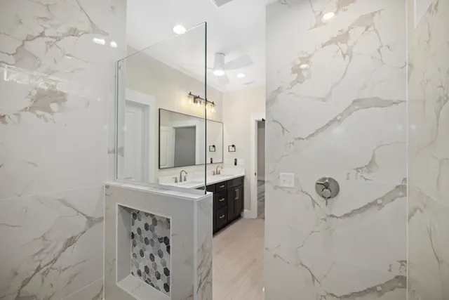 a bathroom with a sink double vanity and a mirror