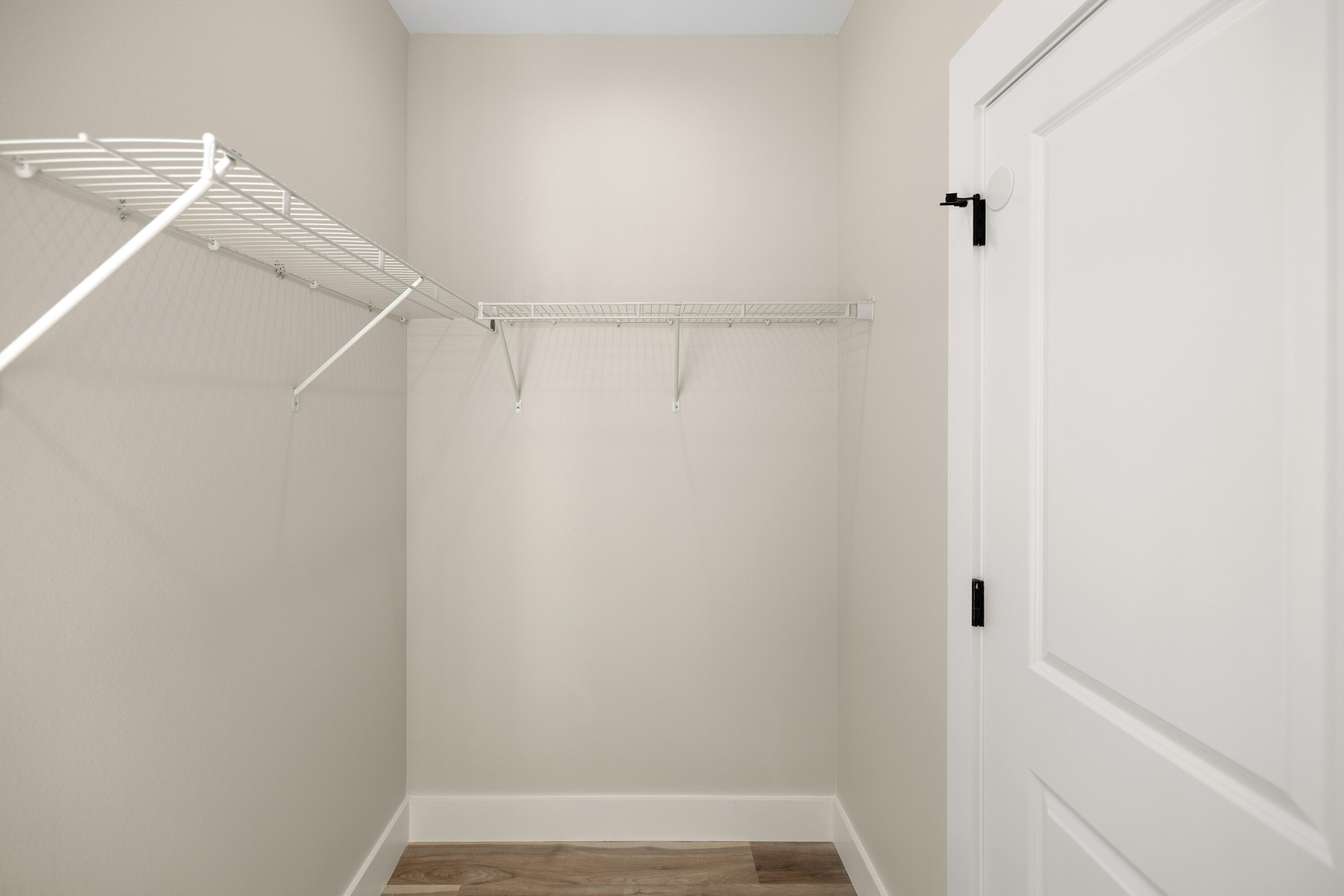 119 Spruce Street Freeport, FL 32439 - Photo 15 of 28 a view of walk in closet with empty racks