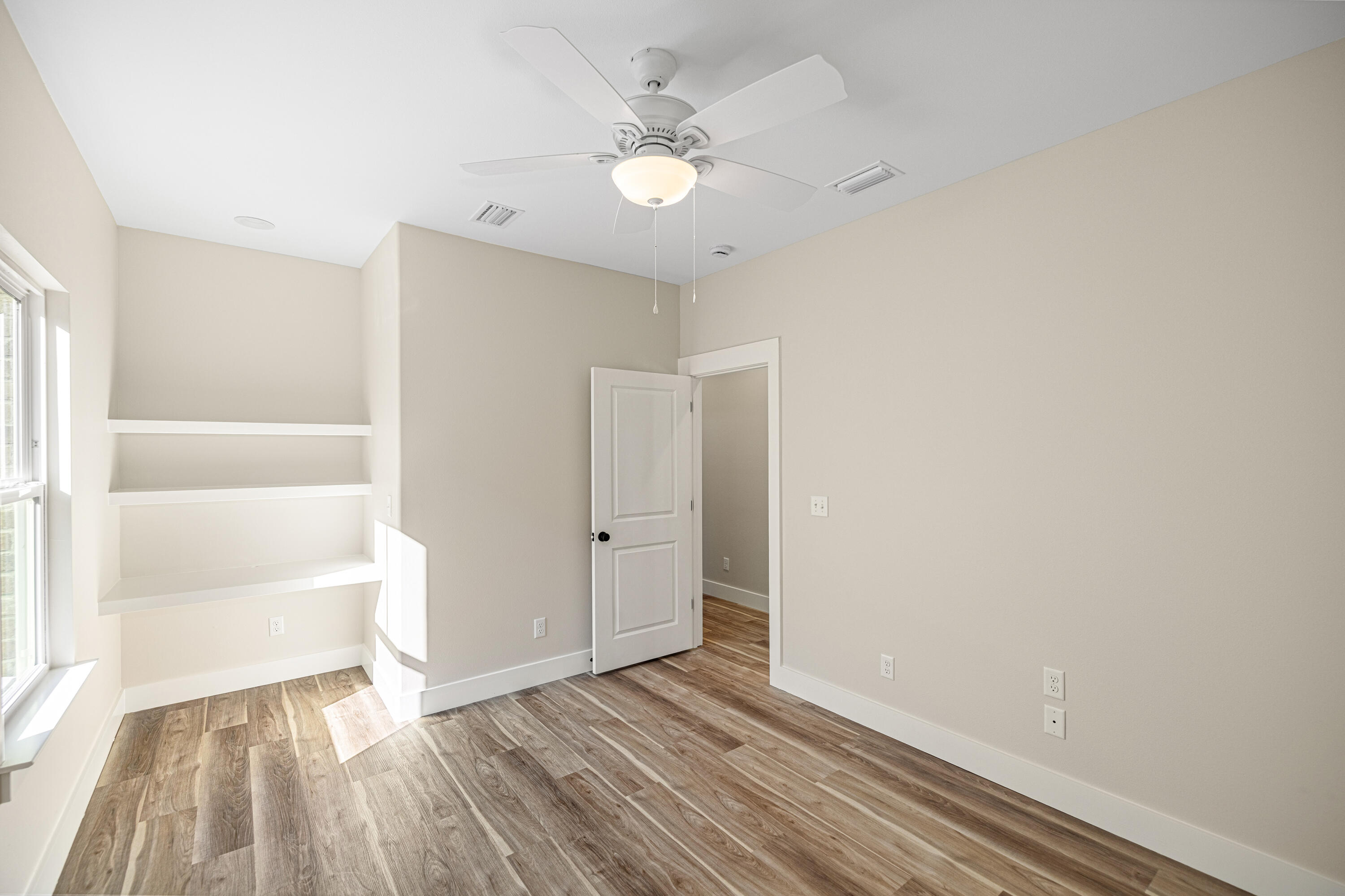 119 Spruce Street Freeport, FL 32439 - Photo 16 of 28 a view of an empty room with a window