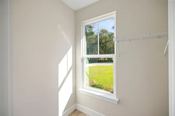 a view of an empty room with a window
