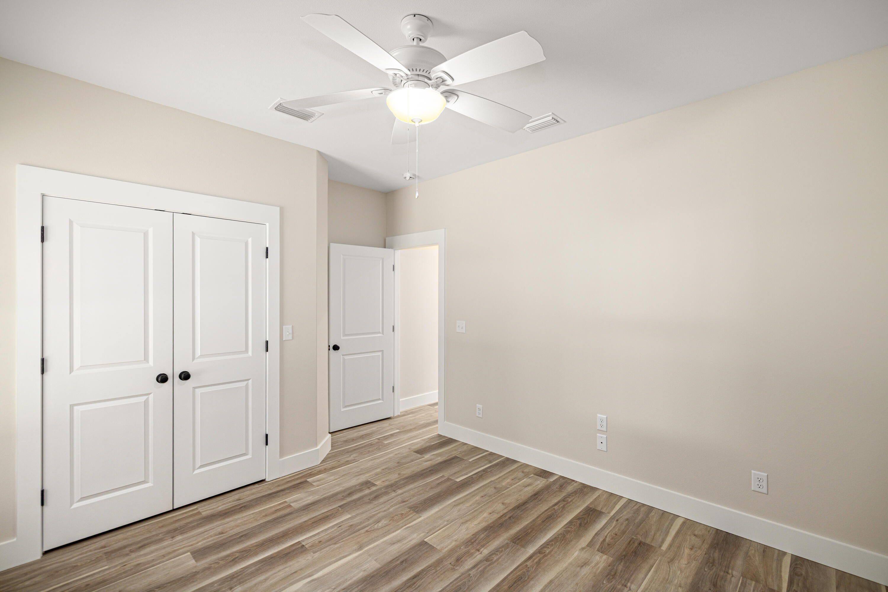 119 Spruce Street Freeport, FL 32439 - Photo 18 of 28 wooden floor in an empty room