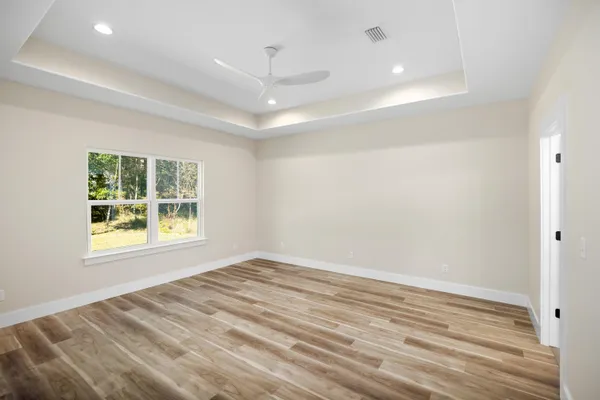 a spacious bathroom with a sink and a large mirror