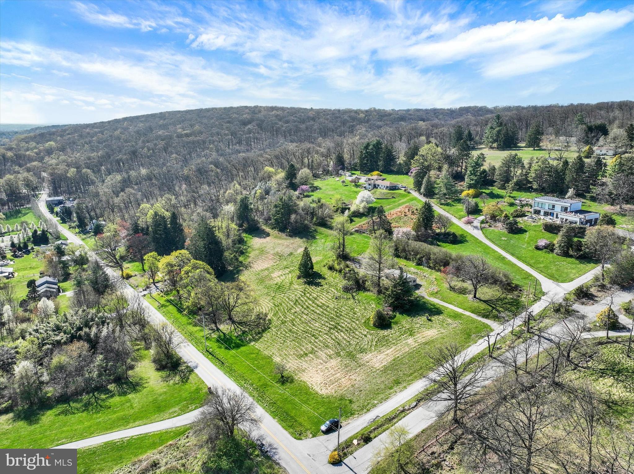 a view of a garden with an outdoor seating