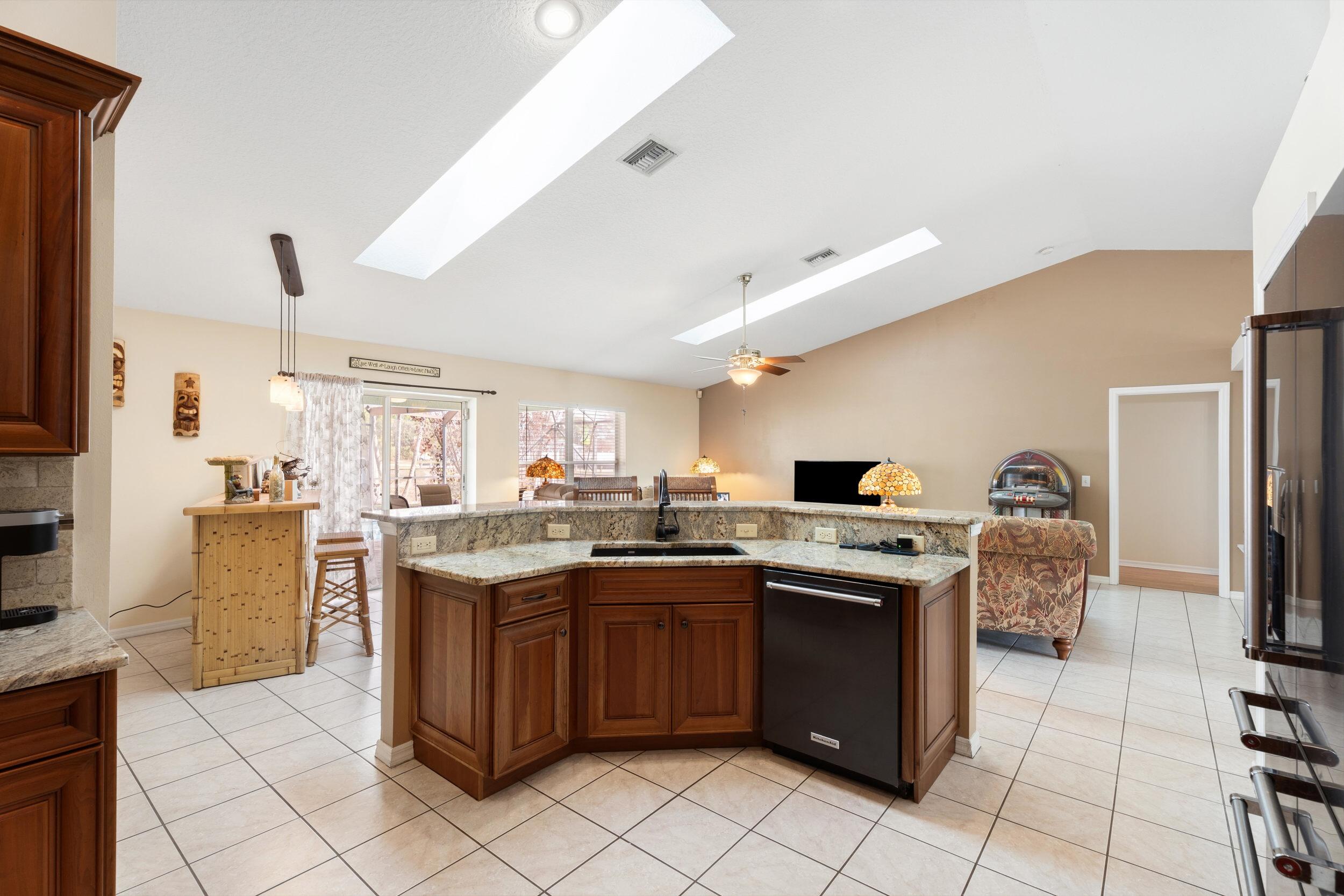 5593 Northwest Wesley Road Port St. Lucie, FL 34986 - Photo 14 of 33 Kitchen overlooking living room