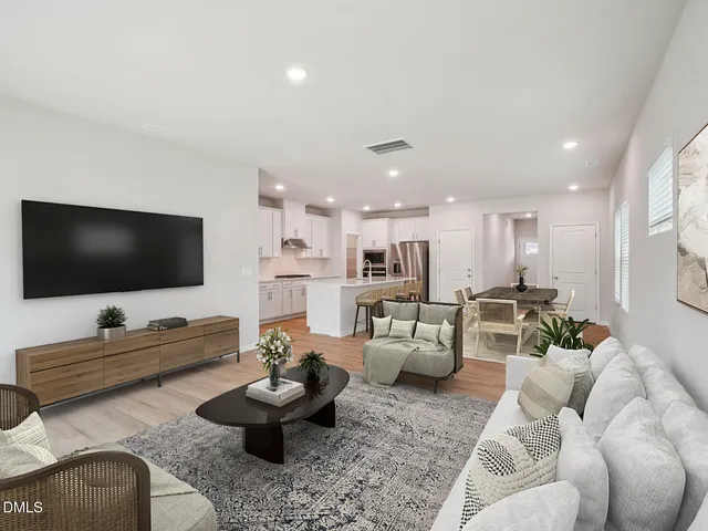 a view of a kitchen with a sink and a refrigerator