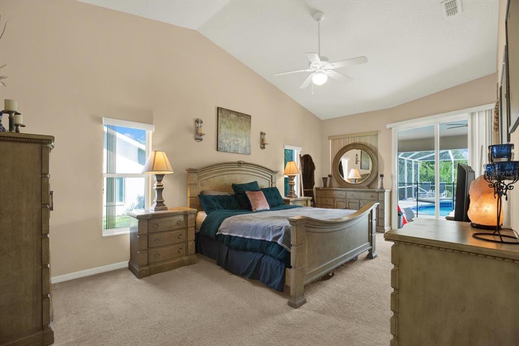 5220 Kirkwood Avenue Spring Hill, FL 34608 - Photo 12 of 39 a bed room with a bed and a large window