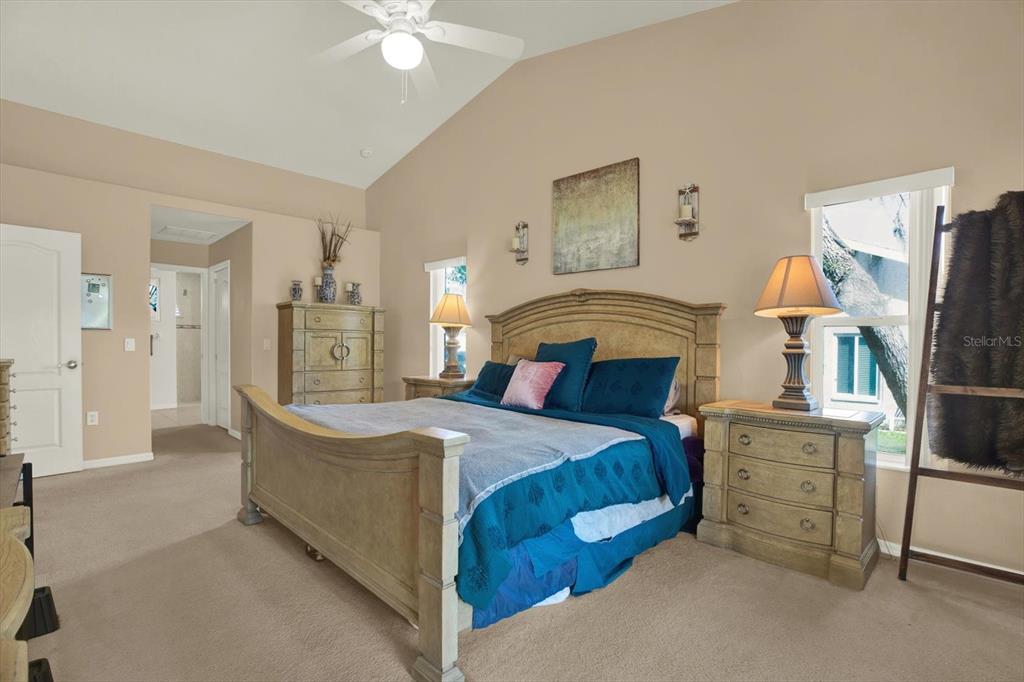 5220 Kirkwood Avenue Spring Hill, FL 34608 - Photo 14 of 39 a bedroom with a bed and a refrigerator