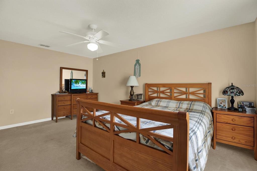 5220 Kirkwood Avenue Spring Hill, FL 34608 - Photo 19 of 39 a bed room with a bed and a television