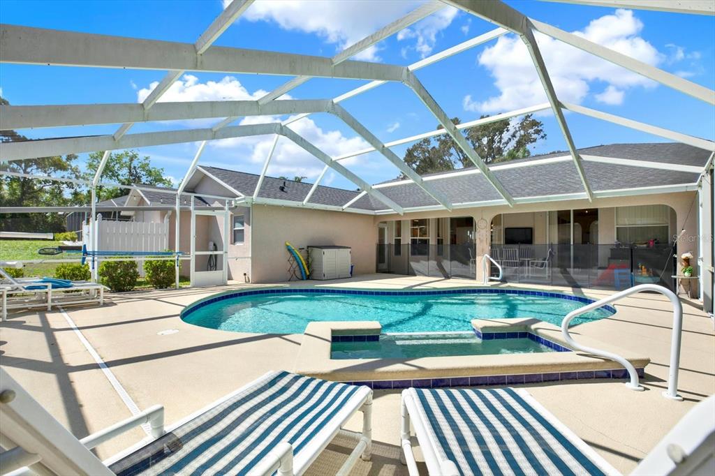 5220 Kirkwood Avenue Spring Hill, FL 34608 - Photo 28 of 39 a view of a house with backyard porch and sitting area