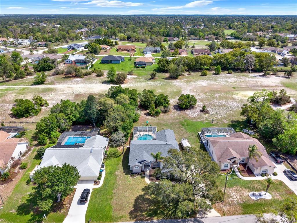 5220 Kirkwood Avenue Spring Hill, FL 34608 - Photo 34 of 39 an aerial view of a city with lots of residential buildings