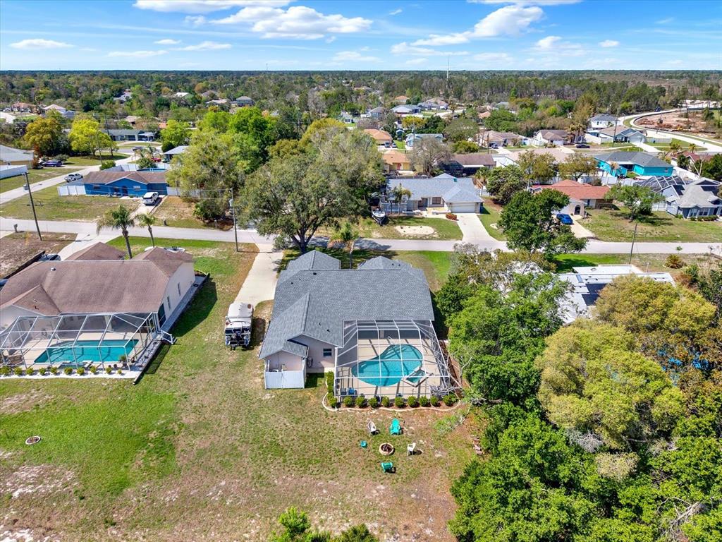 5220 Kirkwood Avenue Spring Hill, FL 34608 - Photo 35 of 39 an aerial view of a house with a garden