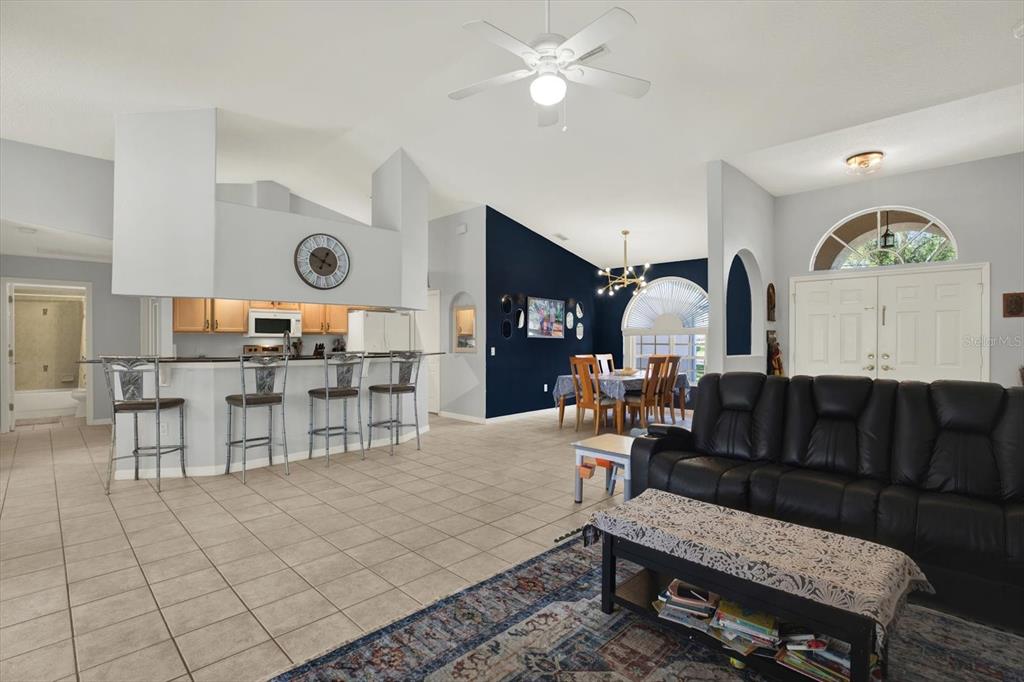 5220 Kirkwood Avenue Spring Hill, FL 34608 - Photo 7 of 39 a living room with furniture and wooden floor
