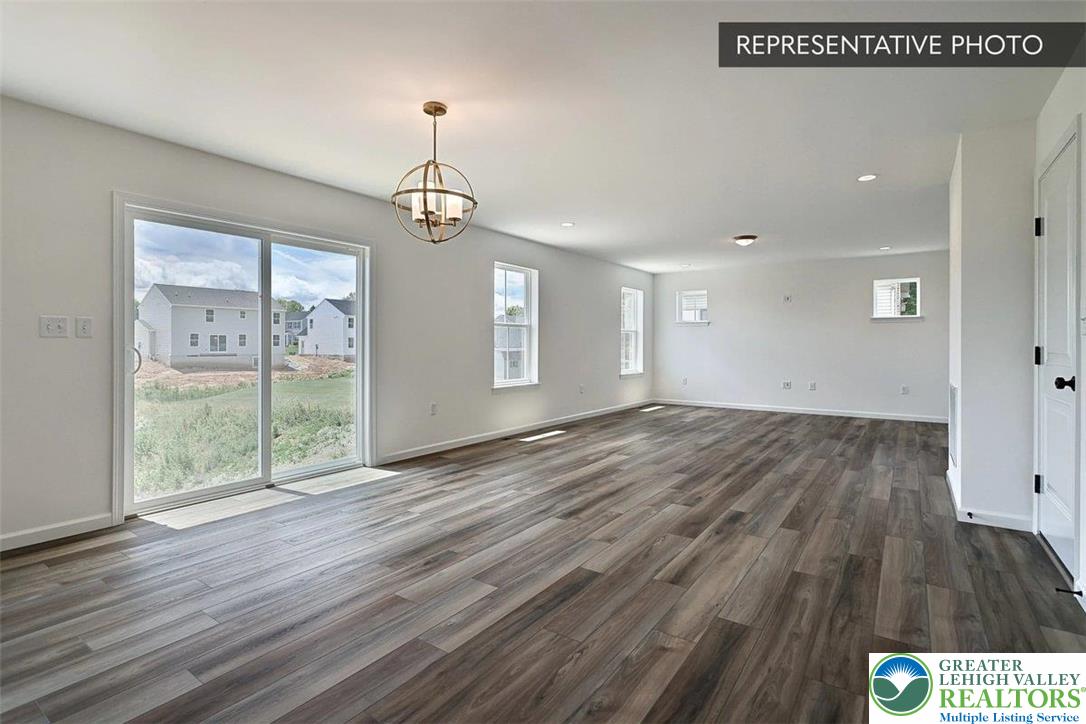 253 West Center Road, Unit LOT 123 Northampton, PA 18067 - Photo 9 of 16 a view of an empty room with wooden floor and a window