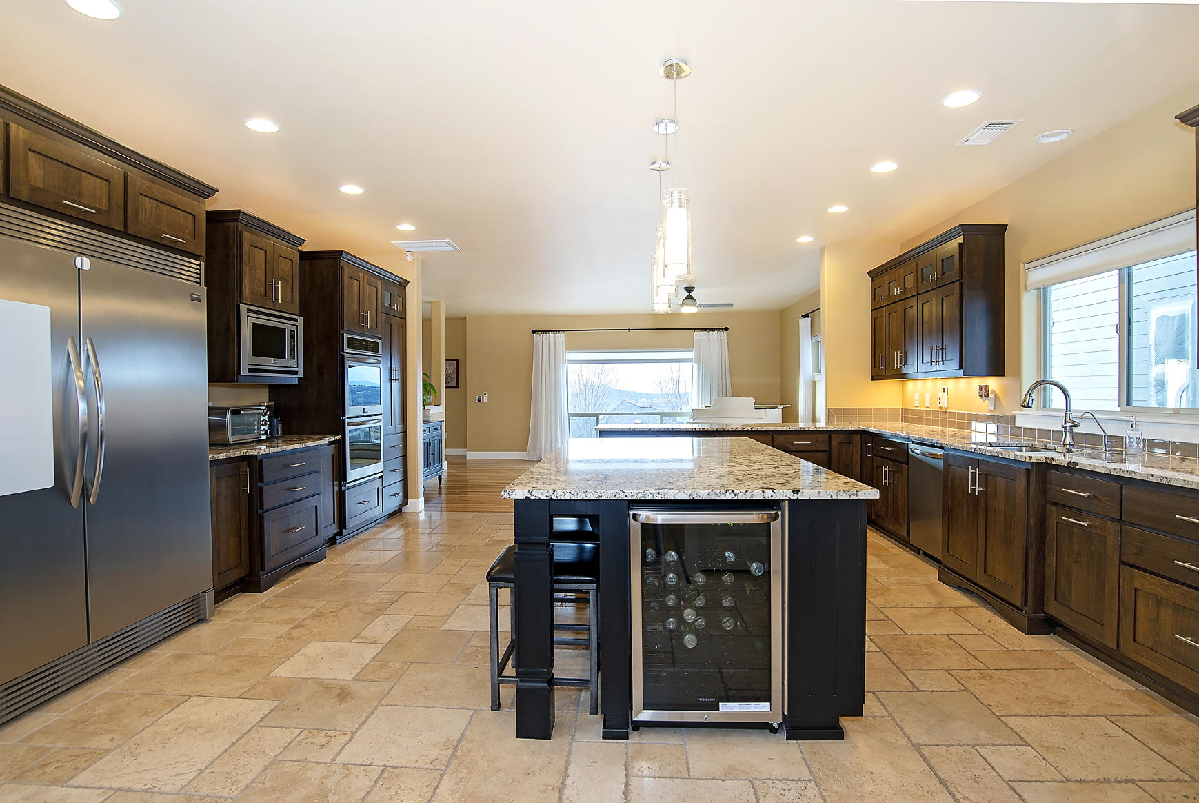 1360 Poppy Ridge Drive Eagle Point, OR 97524 - Photo 2 of 34 a kitchen with stainless steel appliances granite countertop a stove a sink dishwasher and a refrigerator