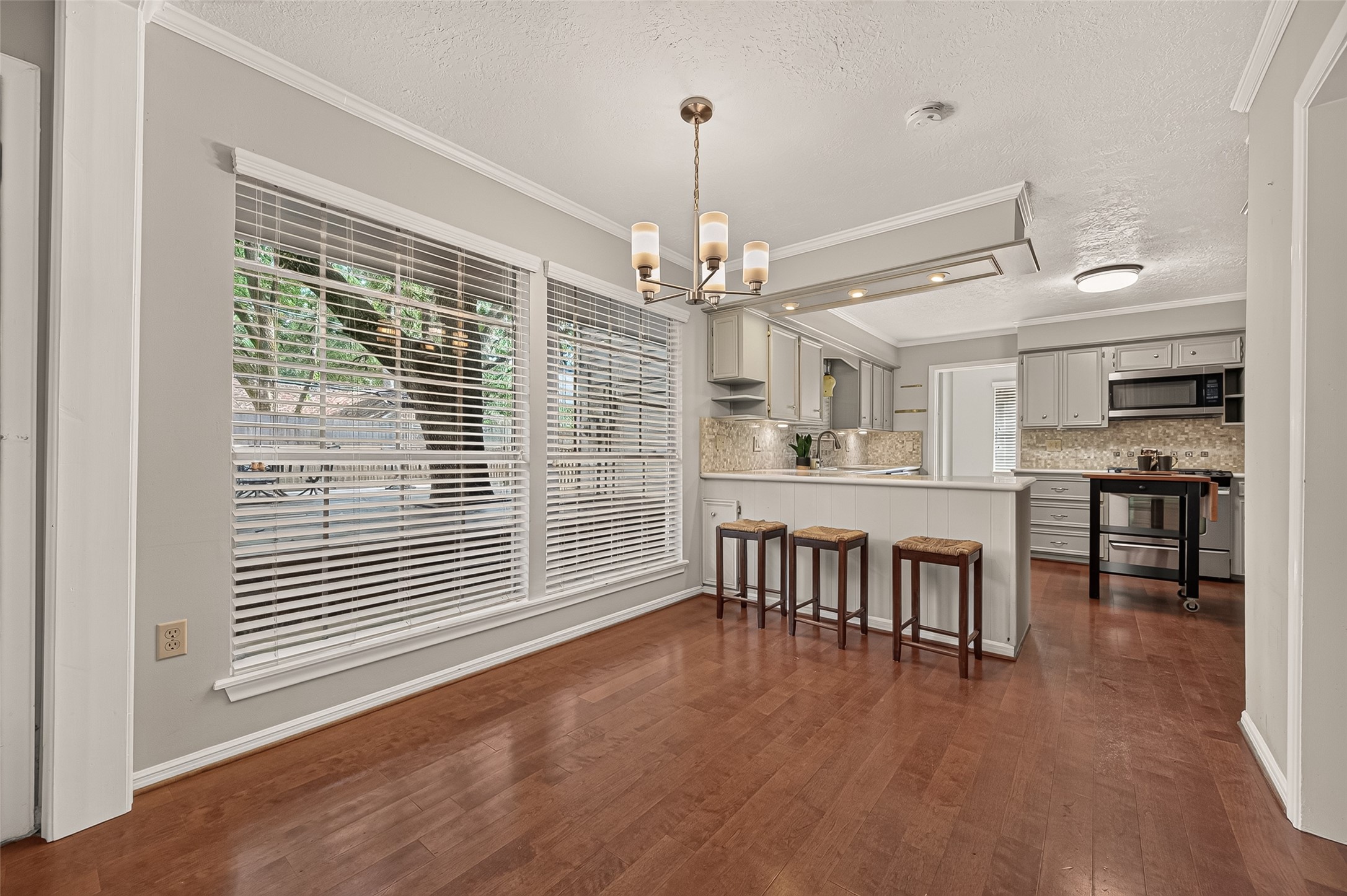 A welcoming breakfast area filled with natural light, offering a comfortable spot for morning coffee, casual meals, and easy conversation