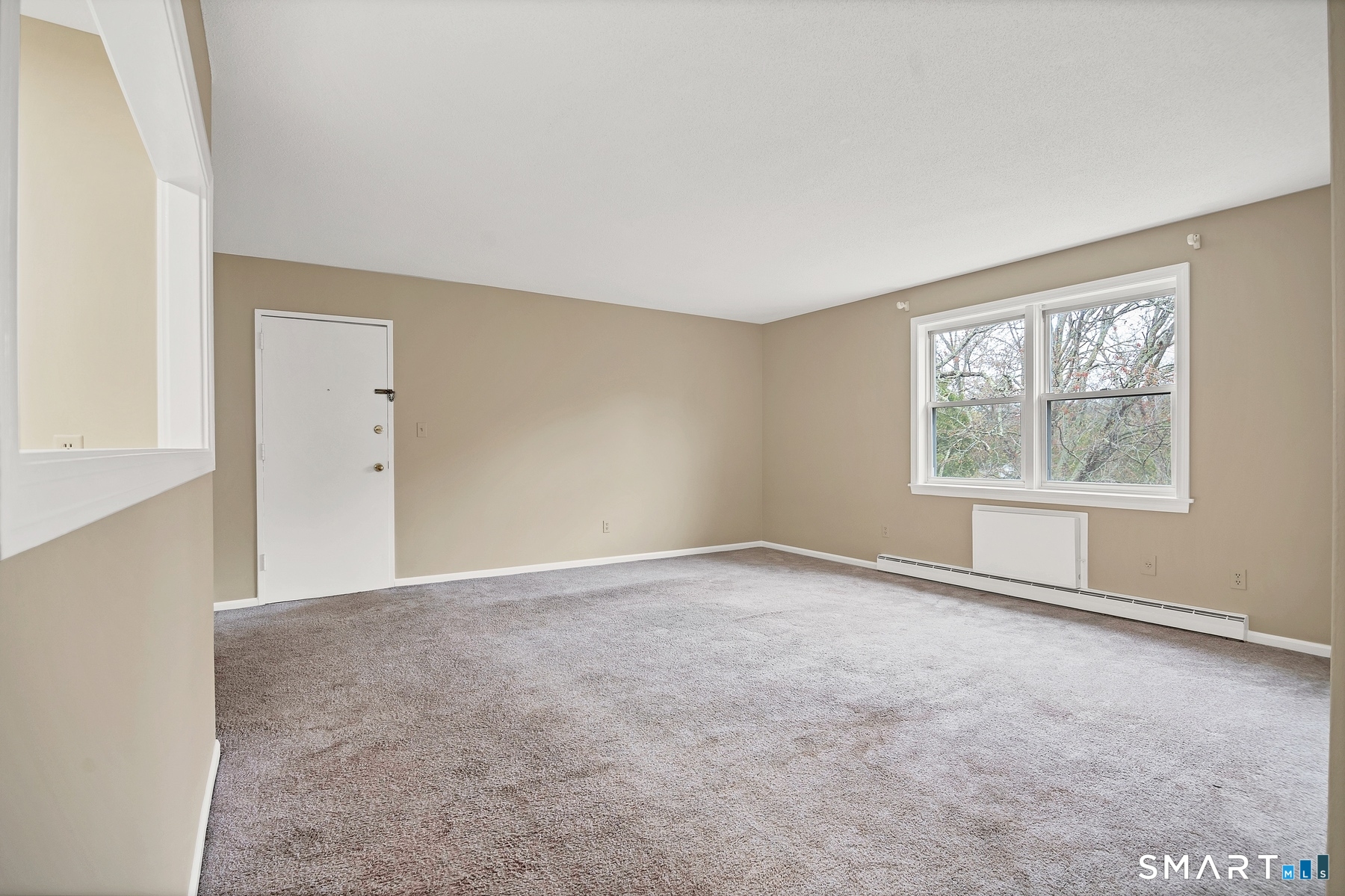 111 Niles Hill Road, Unit E New London, CT 06320 - Photo 15 of 26 an empty room with windows
