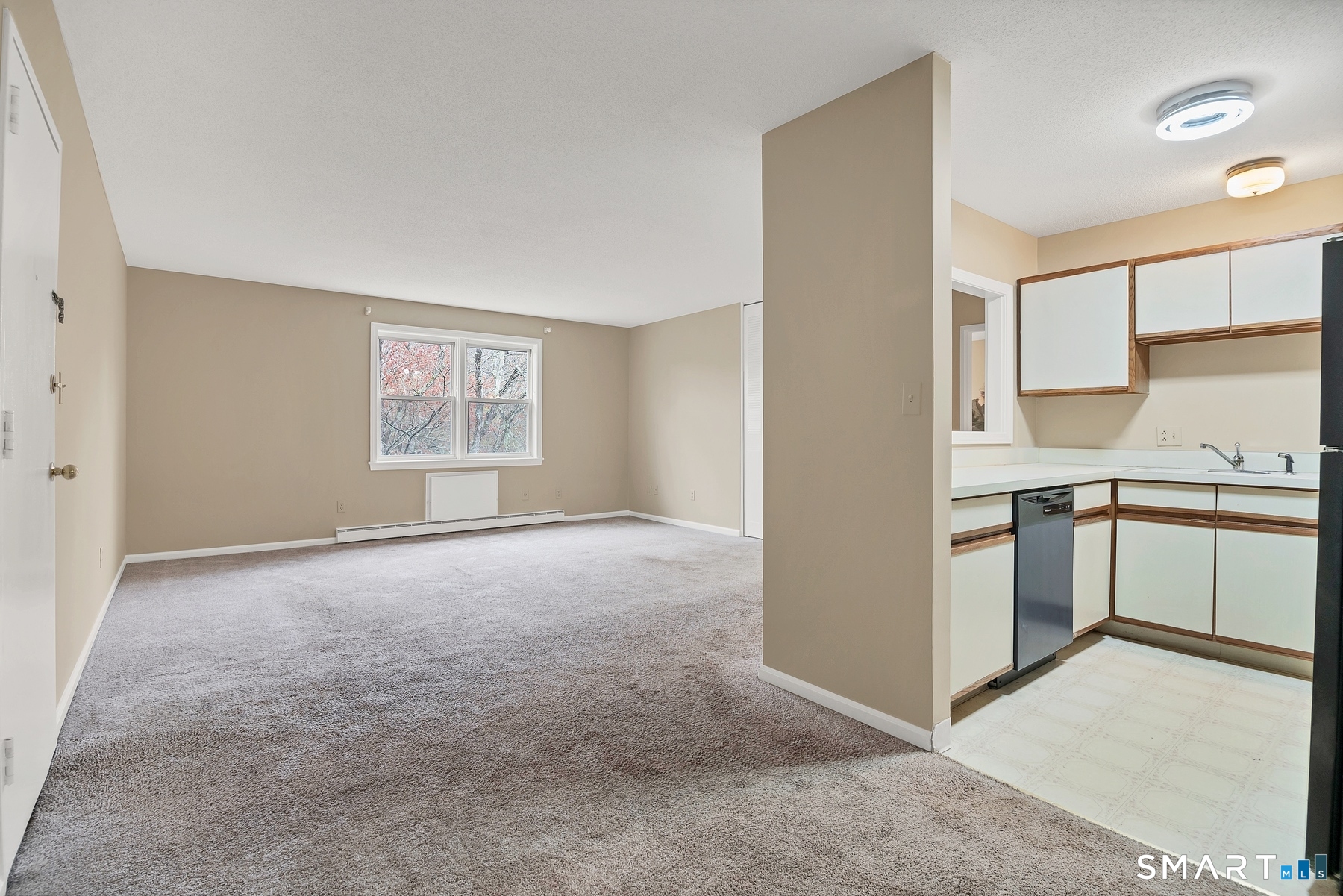 111 Niles Hill Road, Unit E New London, CT 06320 - Photo 17 of 26 a view of a kitchen with a sink cabinets and window