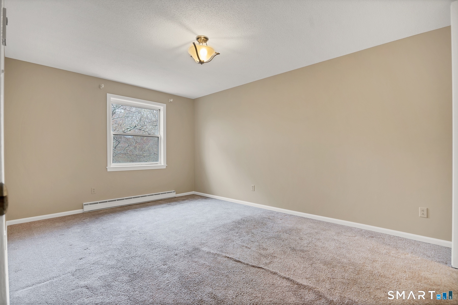 111 Niles Hill Road, Unit E New London, CT 06320 - Photo 21 of 26 an empty room with a window