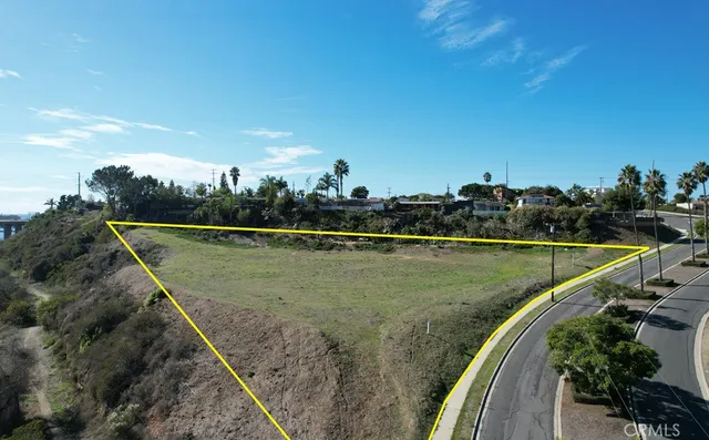 an aerial view of a residential houses with outdoor space