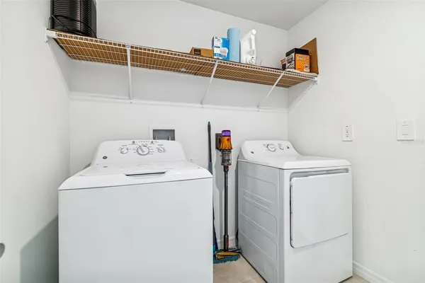 a view of workspace with furniture and a window