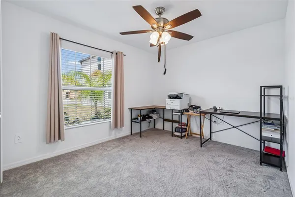a view of a workspace with furniture and toys