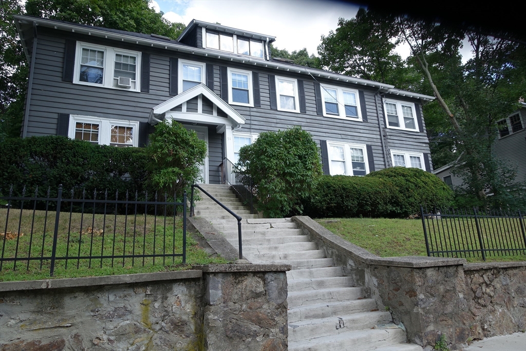 51 Leamington Road, Unit 1 Boston, MA 02135 - Photo 1 of 12 a front view of a house with a garden